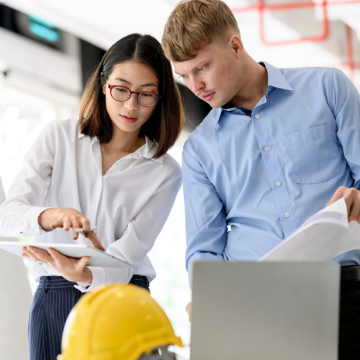 Two Colleagues Looking at Documents