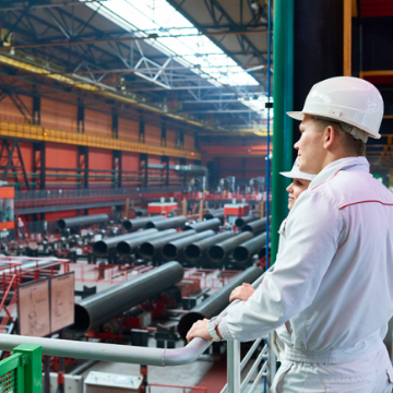 Two Colleagues Looking Across Warehouse