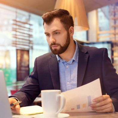 Person sat at desk reviewing data